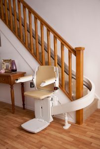 Acorn-Curved-Stairlift-at-bottom-of-staircase (3)